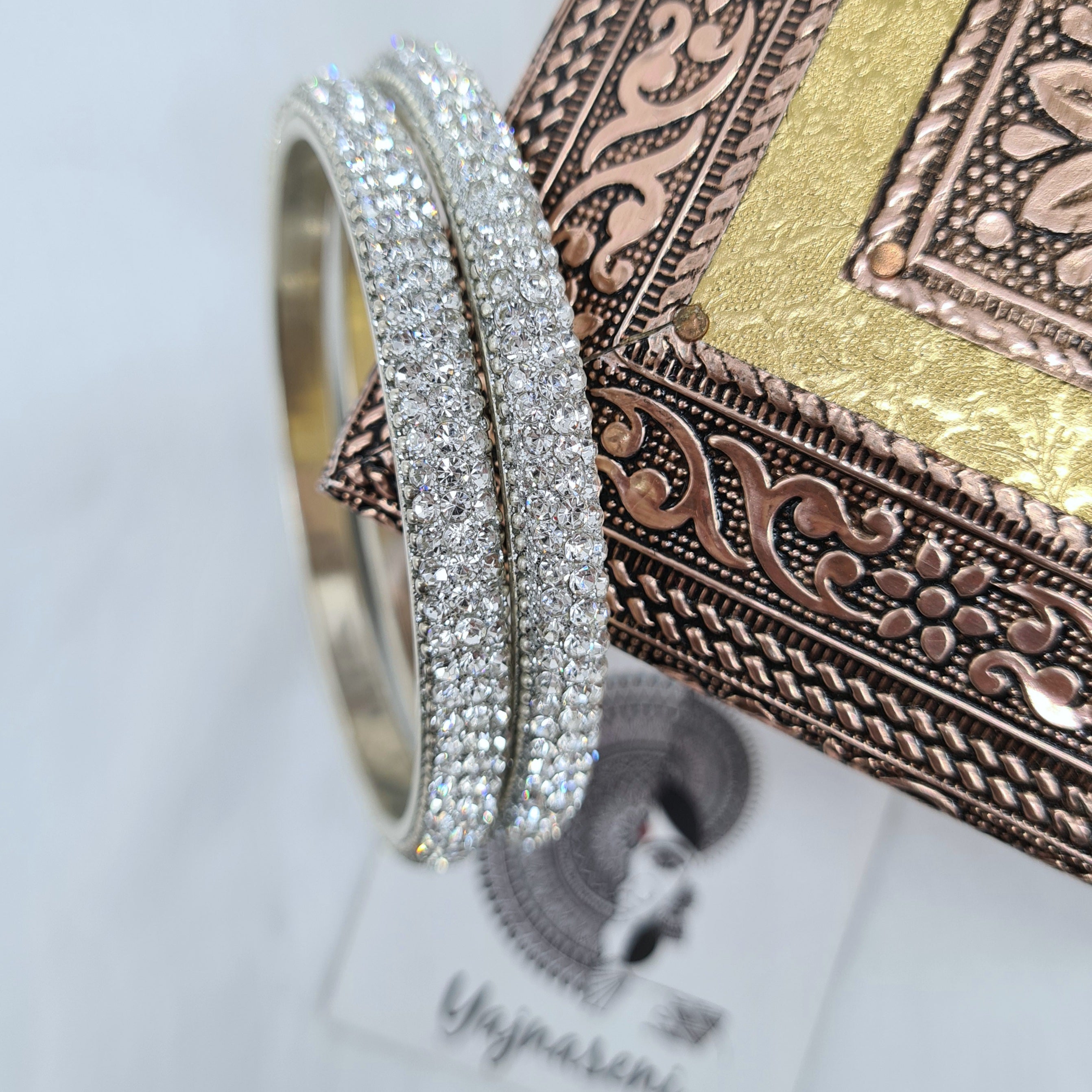 Silver bangles with White stones