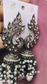 Load and play video in Gallery viewer, Black Peacock Glass Stone Dangler
