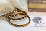 Load image into Gallery viewer, Gold bangles with White stones
